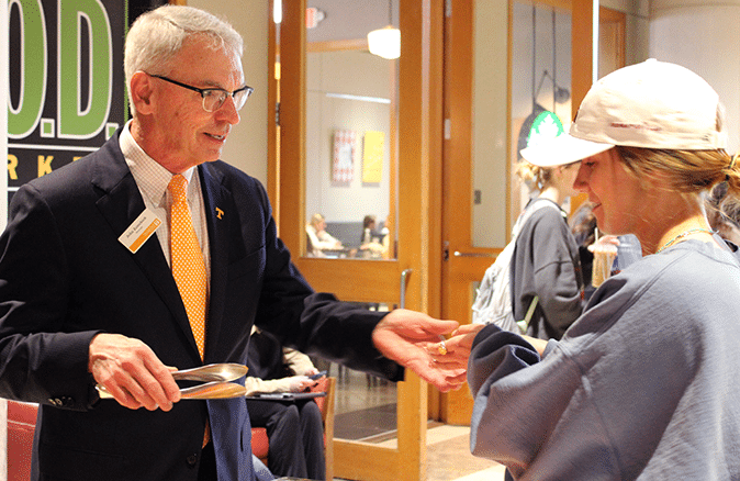 Provost John Zomchick serving snacks at cabinet meet-and-greet in the student union