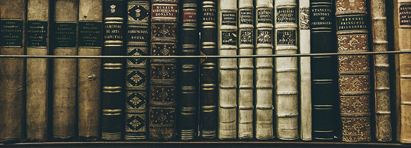 vintage books on bookshelf in library